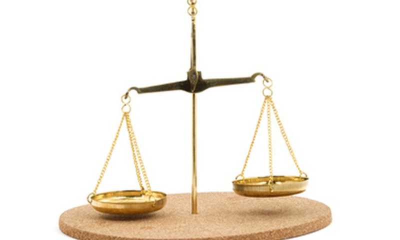 golden balance scales studio isolated